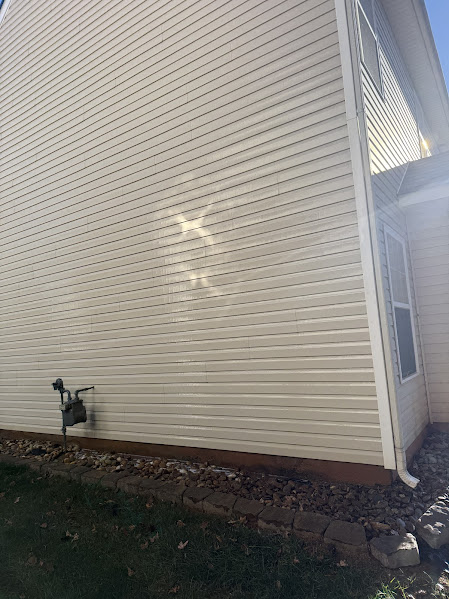 Charlotte home's siding after I preformed a Soft House Wash Service.
