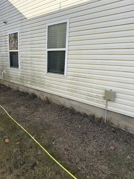 Before Soft Wash on Vinyl Siding in Charlotte, NC.
