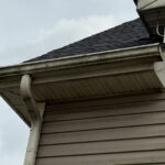 Charlotte Highland Creek Neighborhood Home's dirty exterior gutter face before a Soft House Wash.