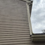 Charlotte Highland Creek Neighborhood Home's dirty siding and trim before a Soft House Wash.
